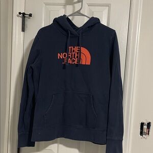 The North Face Dark Blue Hoodie with Bright Orange Logo